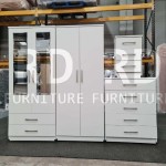 Pre-assembled three-piece set including a classic four-door mirrored wardrobe with two drawers, five-drawer chest, and bedside table set (White).